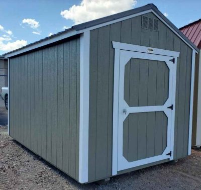 8x12 utility shed, charcoal metal roof, clay walls, barn white trim, 6ft 3in walls, single barn door.