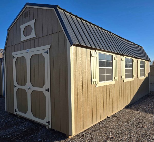 12x24 Lofted Barn, black metal roof, thatch brown walls, crewel tan trim, 7ft tall walls, two double barn doors, six 3x3 windows with shutters on each window, 60psf snow load, engineer certified.