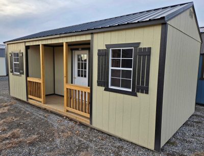 12x24 Side Porch Utility Shed, black metal roof, crewel tan walls, tricorn black trim, 8ft tall walls, three 10" x 35" windows, wood floor, side porch package, 60psf snow load, engineer certified.