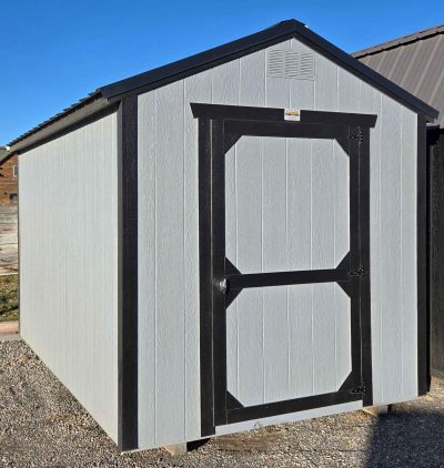 8x12 utility shed, black metal roof, steely gray walls, tricorn black trim, 7ft tall walls, single barn door, 2x3 window, 60psf snow load, engineer certified.