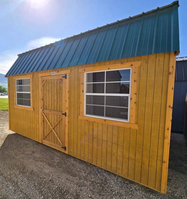 10x16 side lofted barn, hunter green metal roof, pressure treated siding, honey gold water sealed, 7ft wall, 3ft single barn door, two 3x3 windows, two 4ft lofts, wood floor, 60lb snow load, engineer certified.