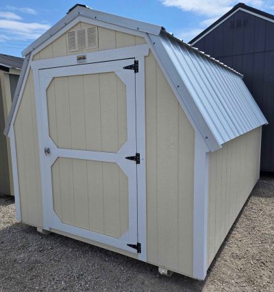 8x12 barn, silver metal roof, eaglet beige walls, barn white trim, 4ft walls, single barn door, wood floor, 30lb snow load, engineer certified.