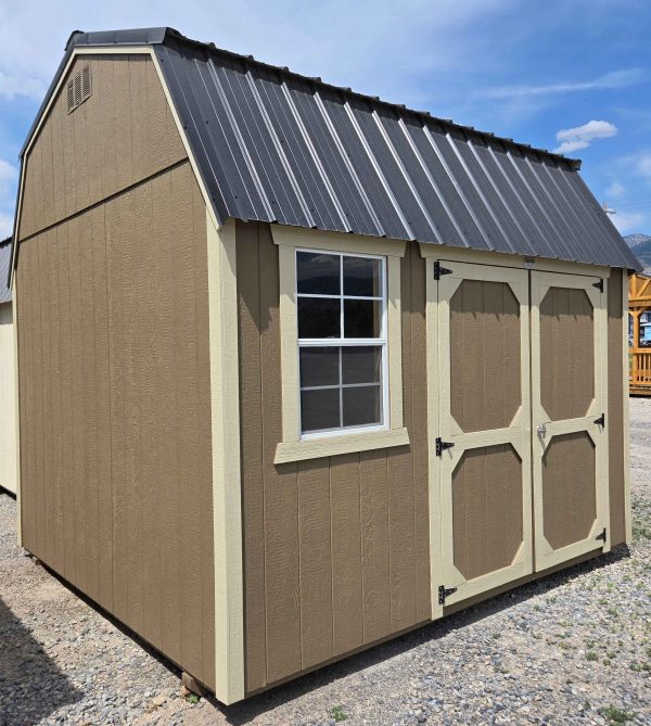 10x12 side lofted barn shed, black metal roof, thatch brown walls, crewel tan trim, 7ft walls, double barn doors, 2x3 window, two 4ft lofts, wood floor, 60lb snow load, engineer certified.