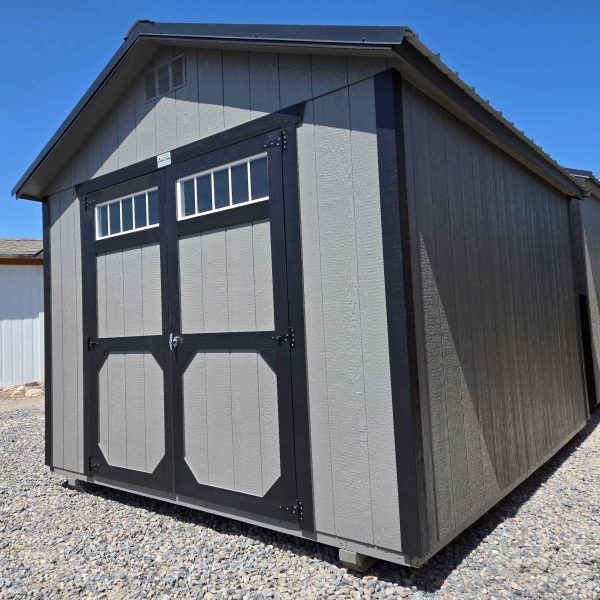 10x12 utility shed, double barn doors with windows, workbench, 2x3 window, peppercorn walls, tricorn black trim, black metal roof, 6 inch front & back roof overhang, wood floor, engineer certified.