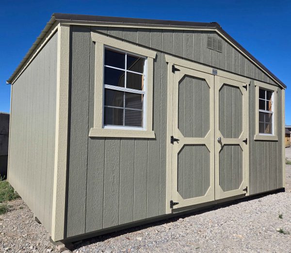 12x16 side gable shed, burnished slate metal roof, rosemary green walls, crewel tan trim, 7ft walls, double barn doors, two 2x3 windows, wood floor, 60lb snow load, engineer certified.