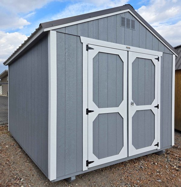 10x12 utility shed, charcoal metal roof, steely gray walls, barn white trim, 7ft walls, double barn doors, wood floor, 60lb snow load, engineer certified.