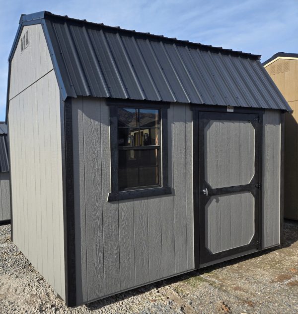 10x12 side lofted barn, black metal roof, gauntlet gray walls, tricorn black trim, 7ft tall walls, single barn door, black 2x3 window, two 4ft lofts, wooden floor, 60lb snow load, engineer certified.