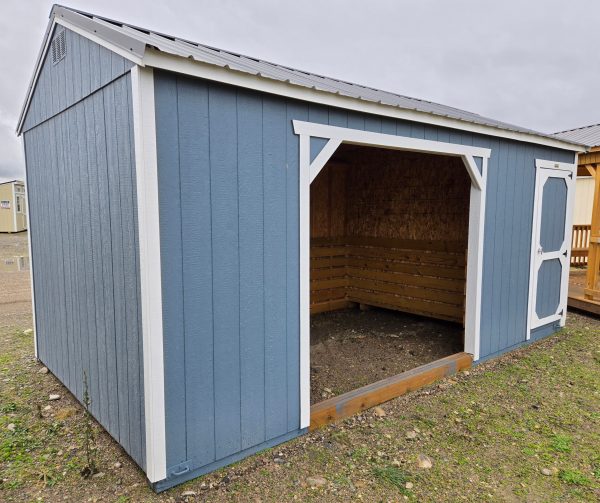 10x20 animal shelter with 4ft enclosed tack room, charcoal metal roof, smokey blue walls, barn white trim, 8ft tall walls, 3ft barn door, 8ft wide shelter opening, inside shelter walls lined with kick boards, 60lb snow load, engineer certified.