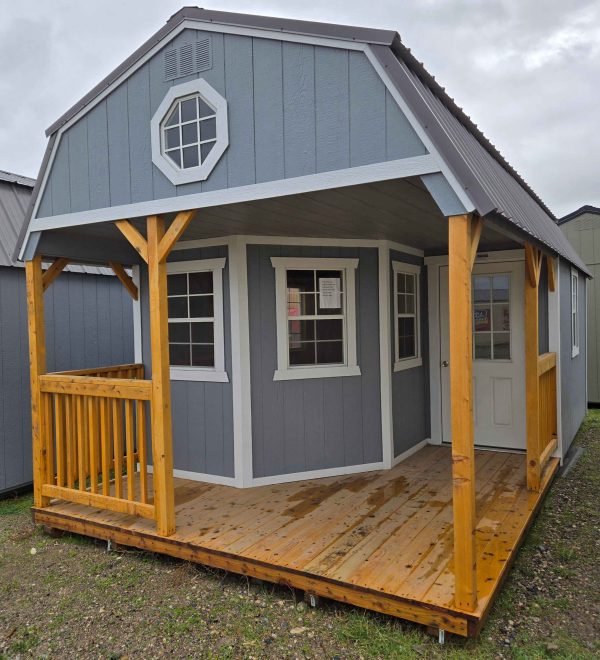 12x24 deluxe playhouse lofted barn, charcoal metal roof, smart panel siding steely gray color, barn white trim, wrap around porch on end, five 2x3 windows, 9-lite house door, house wrap, 20ft of loft. octagon window in front loft, wood floor, 60lb snow load, engineer certified.
