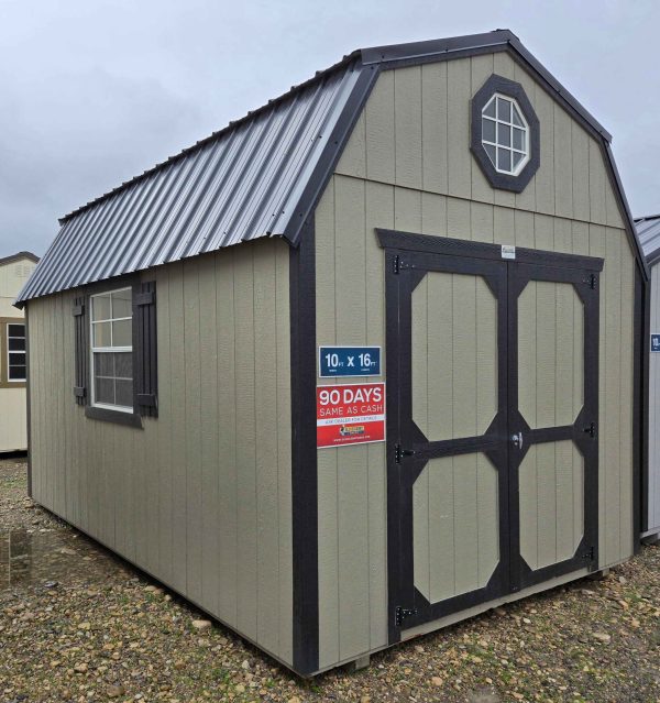 10x16 lofted barn shed, black metal roof, hardware walls, tricorn black trim, 7ft walls, two 4ft lofts, octagon window in front loft, two 2x3 windows with shutters, double barn doors, 10ft 3-tier shelving, wooden floor, 60lb snow load, engineer certified.