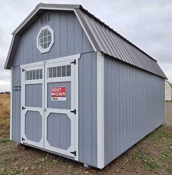10x20 lofted barn shed, 6 inch roof overhang front & back, charcoal metal roof, steely gray walls, barn white trim, 7ft walls, two 4ft lofts, octagon window in front loft, double barn doors with windows, 10ft 3-tier shelving, wooden floor, 60lb snow load, engineer certified.