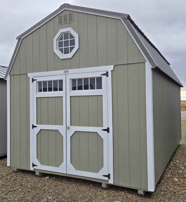 12x16 Lofted Barn, burnished slate metal roof, hardware walls, barn white trim, 7ft tall walls, double barn doors with windows, two 4ft lofts, octagon window in front loft, shelves, wood floor, 60psf snow load, engineer certified.