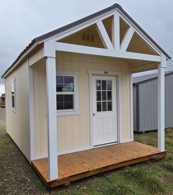 10x20 vaulted dormer playhouse utility shed, 7/12 roof pitch, burnished slate metal roof, eaglet beige walls, barn white trim, 8ft walls, three 2x3 vinyl insulated windows, 4ft porch, wood floor, 60lb snow load, engineer certified.