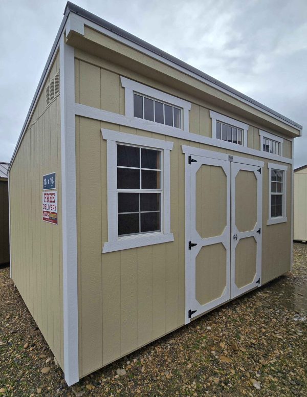 10x16 single slope shed, burnished slate metal roof, crewel tan walls, barn white trim, three 2x3 windows, three 10"x29" horizontal windows, workbench, double barn doors, wood floor, 60lb snow load, engineer certified.