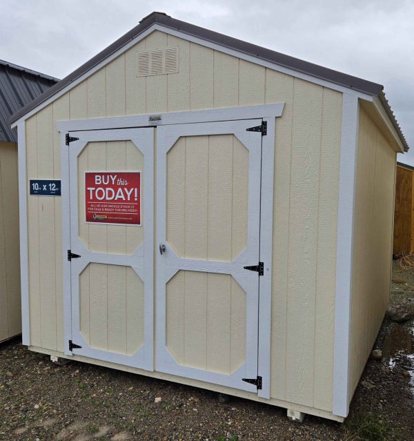 10x12 utility shed, charcoal metal roof, eaglet beige walls, barn white trim, 7ft walls, double barn doors, wood floor, 60lb snow load, engineer certified.