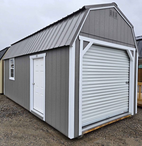 10x20 lofted barn garage, charcoal metal roof, gauntlet gray walls, barn white trim, 7ft tall walls, 2x3 window, solid house door, 8'x7' roll up door, two 4' lofts, wood floor, 60lb snow load, engineer certified.