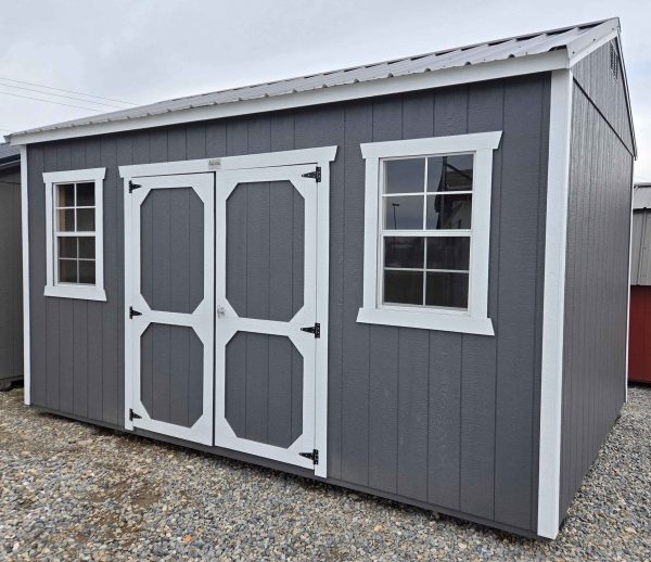 10x16 side utility shed, charcoal metal roof, peppercorn walls, barn white trim, 8ft tall walls, double barn doors, two 2x3 windows, wood floor, 60lb snow load, engineer certified.