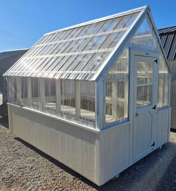 8x12 greenhouse, 12/12 roof pitch, 21" x 21" automatic louvre vent door, pressure treated deck-style floor, 18" deep perimeter potting shelf, smart panel base siding pine cone solid stain.