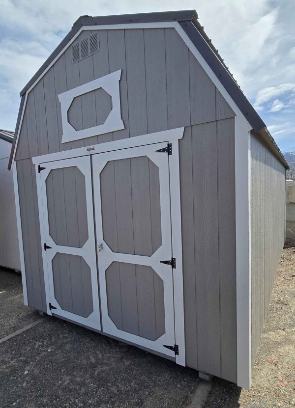 10x20 lofted barn shed, charcoal metal roof, pewter cast walls, barn white trim, 7ft walls, two 4ft lofts, wood floor, 60lb snow load, engineer certified.