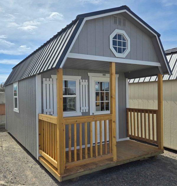 10x20 playhouse lofted barn shed, 4ft porch, railings, 2' x 3' window with shutters, two 2' x 3' windows, 9-lite window house door, black metal roof, pewter cast walls, barn white trim, 7ft tall walls, front 4ft loft with octagon window, back 4ft loft, 60lb snow load, engineer certified.