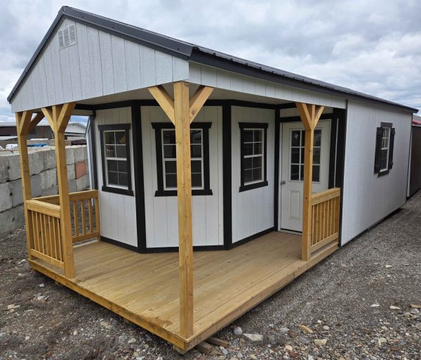 12x28 deluxe playhouse utility shed, black metal roof, five 2x3 windows, 9 lite window house door, wooden floor, 8ft tall walls, 60lb snow load, engineer certified.