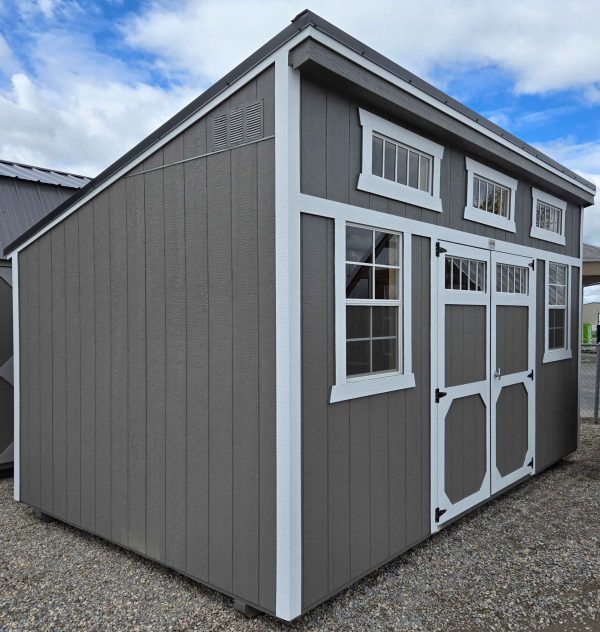 10x16 single slope shed, black metal roof, gauntlet gray walls, barn white trim, two 2' x 3' windows, three 10" x 29" horizontal windows, double barn doors with windows, wood floor, 60lb snow load, engineer certified.