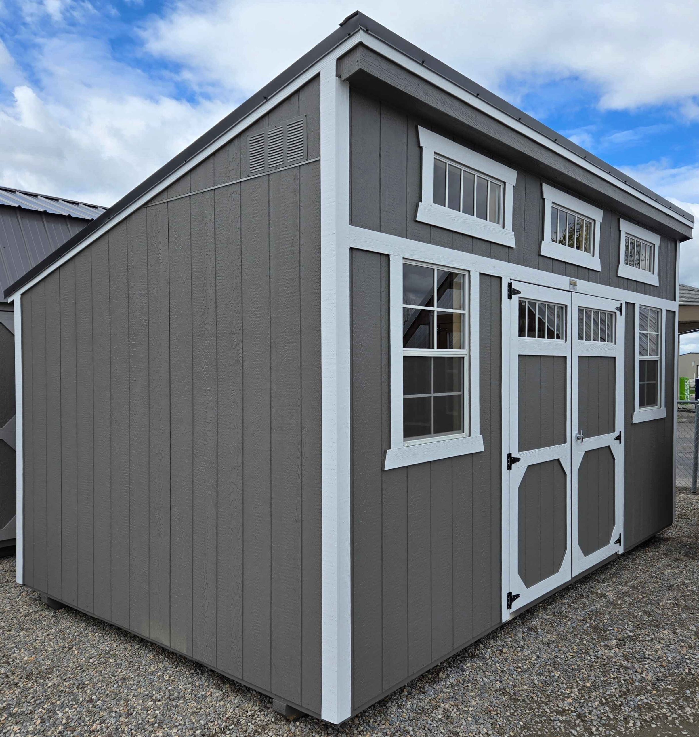 10x16 single slope shed, black metal roof, gauntlet gray walls, barn white trim, two 2' x 3' windows, three 10" x 29" horizontal windows, double barn doors with windows, wood floor, 60lb snow load, engineer certified.