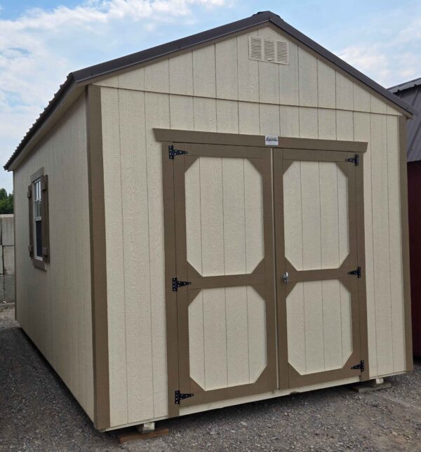 10x16 utility shed, burnished slate metal roof, eaglet beige walls, thatch brown trim, 8ft tall walls, double barn doors, three 2'x3' windows with shutters, wood floor, 60lb snow load, engineer certified.